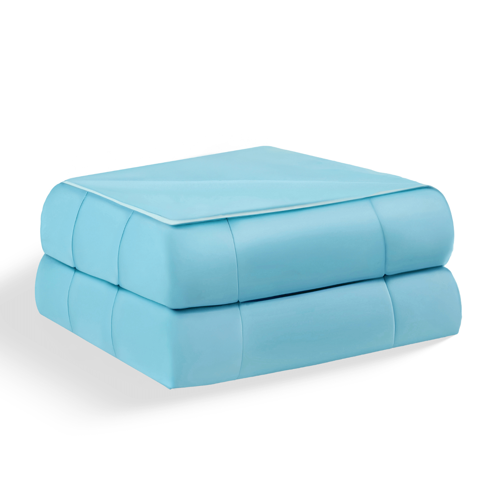 A folded light blue quilted comforter with white piping on a plain studio backdrop.