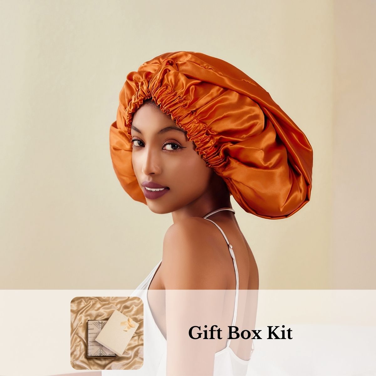 A woman with long hair wears an orange mulberry silk bonnet, with an inset showing a gift box kit.