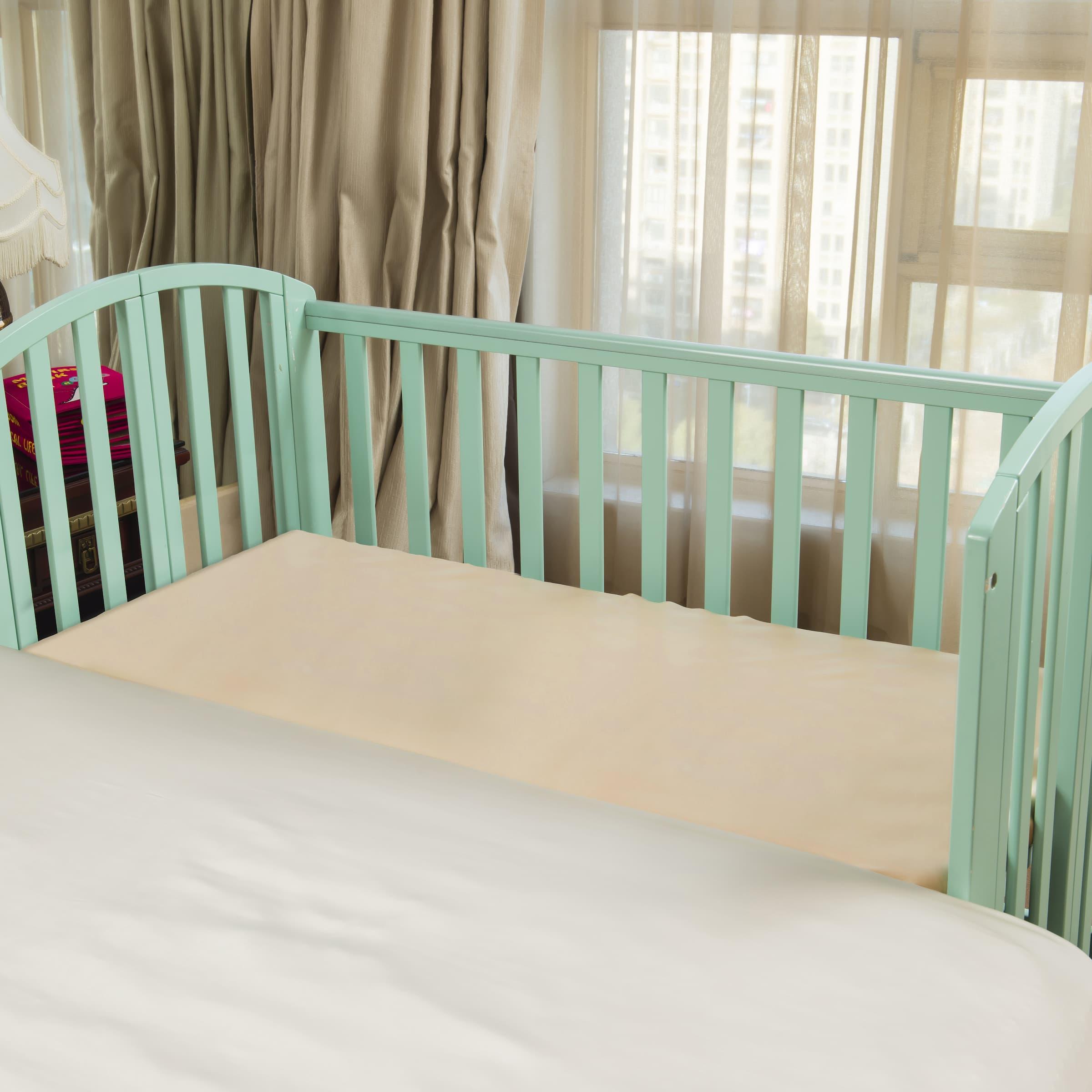 Soft mulberry silk crib sheet providing a smooth surface to prevent baby hair loss